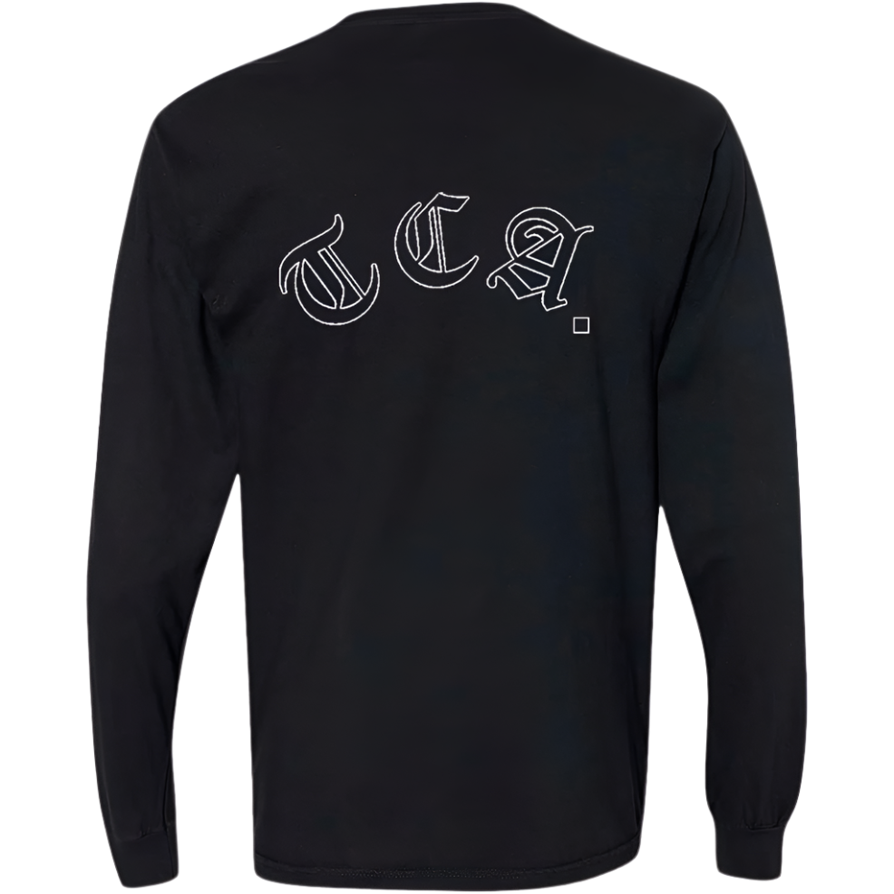 Back view of a black long sleeve The CEO. Apparel shirt featuring large white gothic-style TCA lettering across the shoulders.