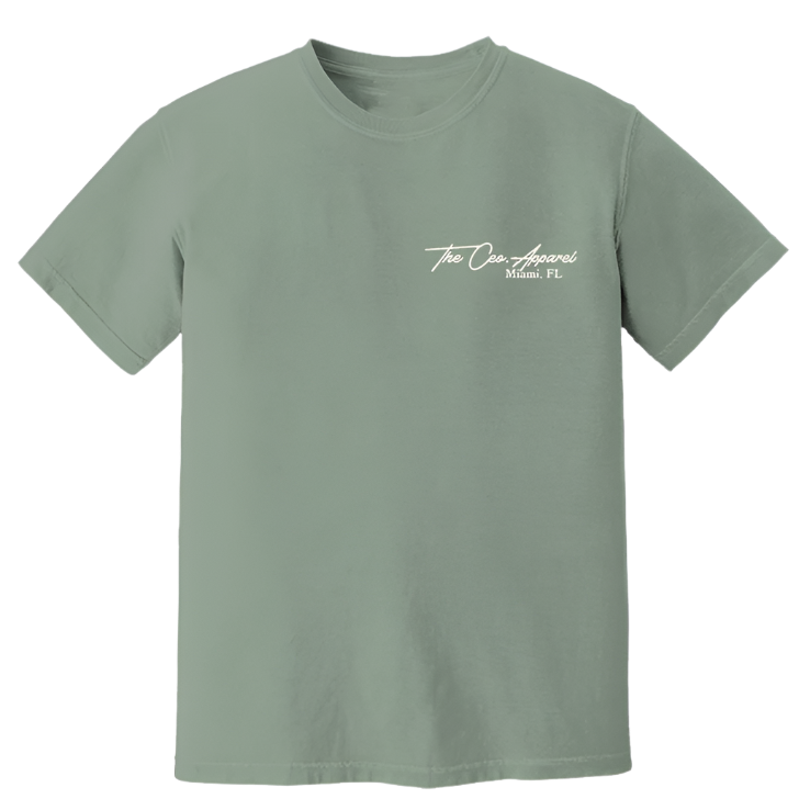 Front view of sage green The CEO. Apparel t-shirt with white “Miami, FL” script logo on the chest.
