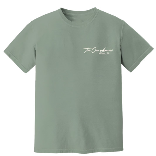 Front view of sage green The CEO. Apparel t-shirt with white “Miami, FL” script logo on the chest.