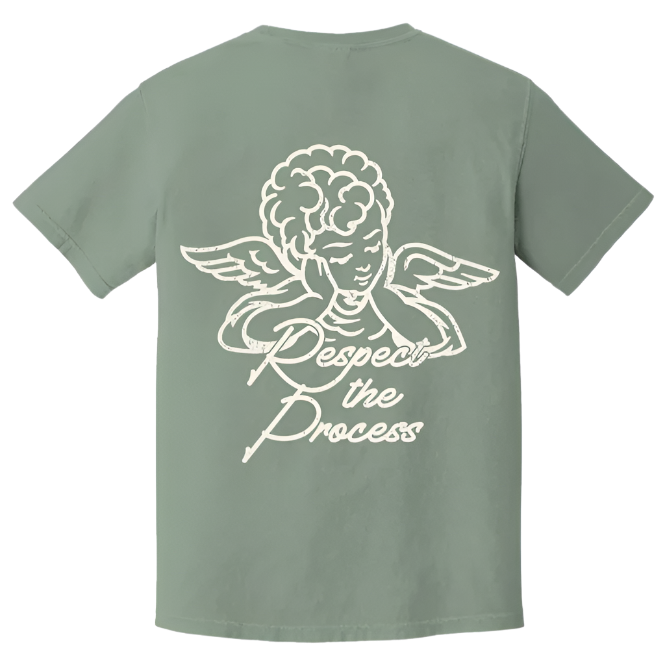 Back view of sage green The CEO. Apparel t-shirt featuring a white angel graphic and the phrase “Respect the Process” in script font.