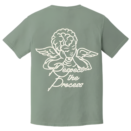 Back view of sage green The CEO. Apparel t-shirt featuring a white angel graphic and the phrase “Respect the Process” in script font.