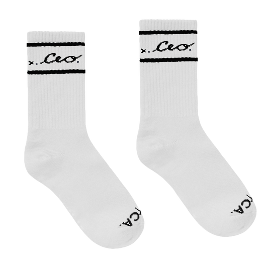 Pair of white CEO. crew socks with black logo embroidery, displayed side by side